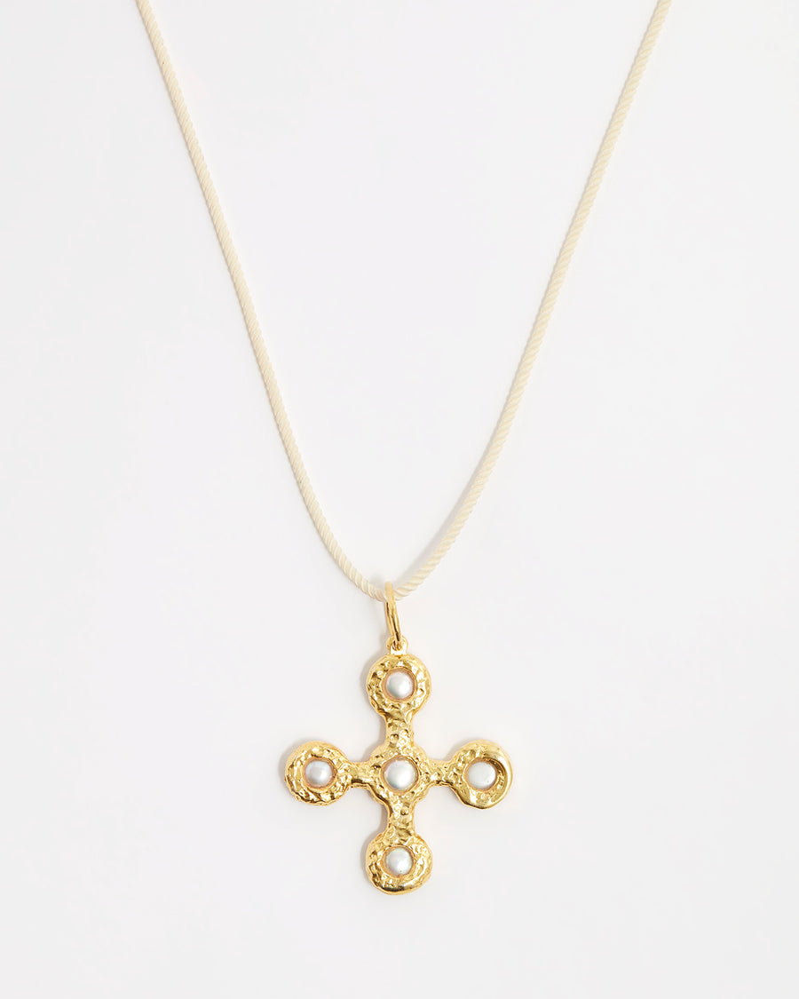 back of pearl and gold gemstone pendant cross necklace on cord