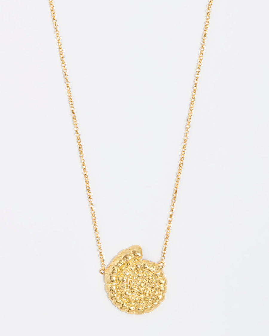 gold fossil pendant on thin chain necklace