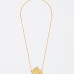 gold fossil pendant on thin chain necklace