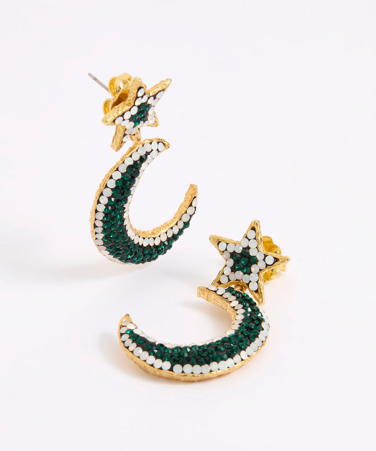 A pair of gold crescent moon and star earrings embellished with dark green and white opal crystals, displayed on a white background.