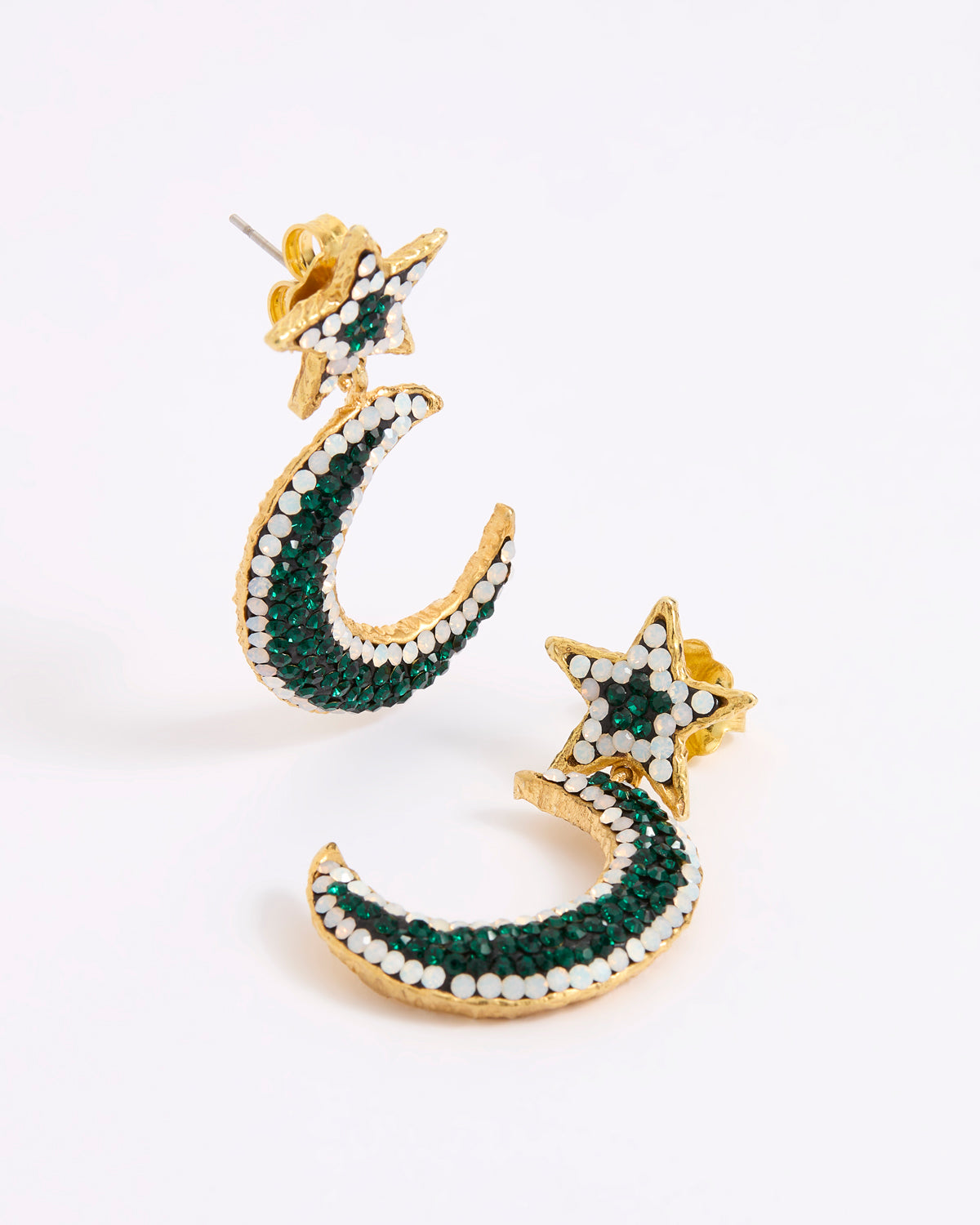 A pair of gold crescent moon and star earrings embellished with dark green and white opal crystals, displayed on a white background.