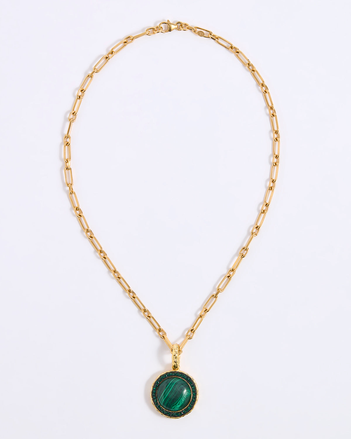 A gold chain necklace featuring a smooth, circular green malachite pendant, framed by a delicate border of sparkling green crystals, displayed against a white background.