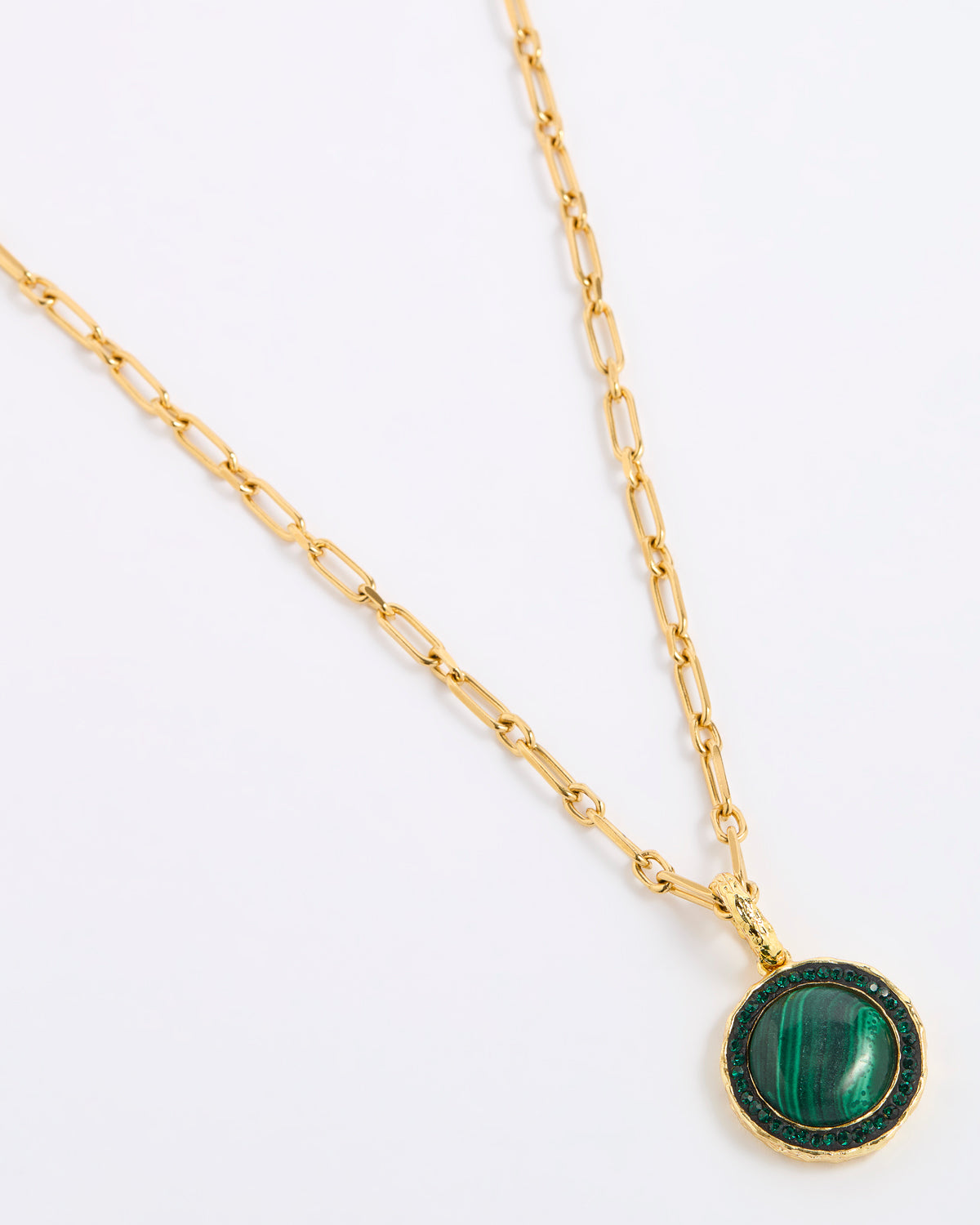 A gold chain necklace featuring a round pendant with a green malachite stone and a dark green crystal border, displayed on a white background.