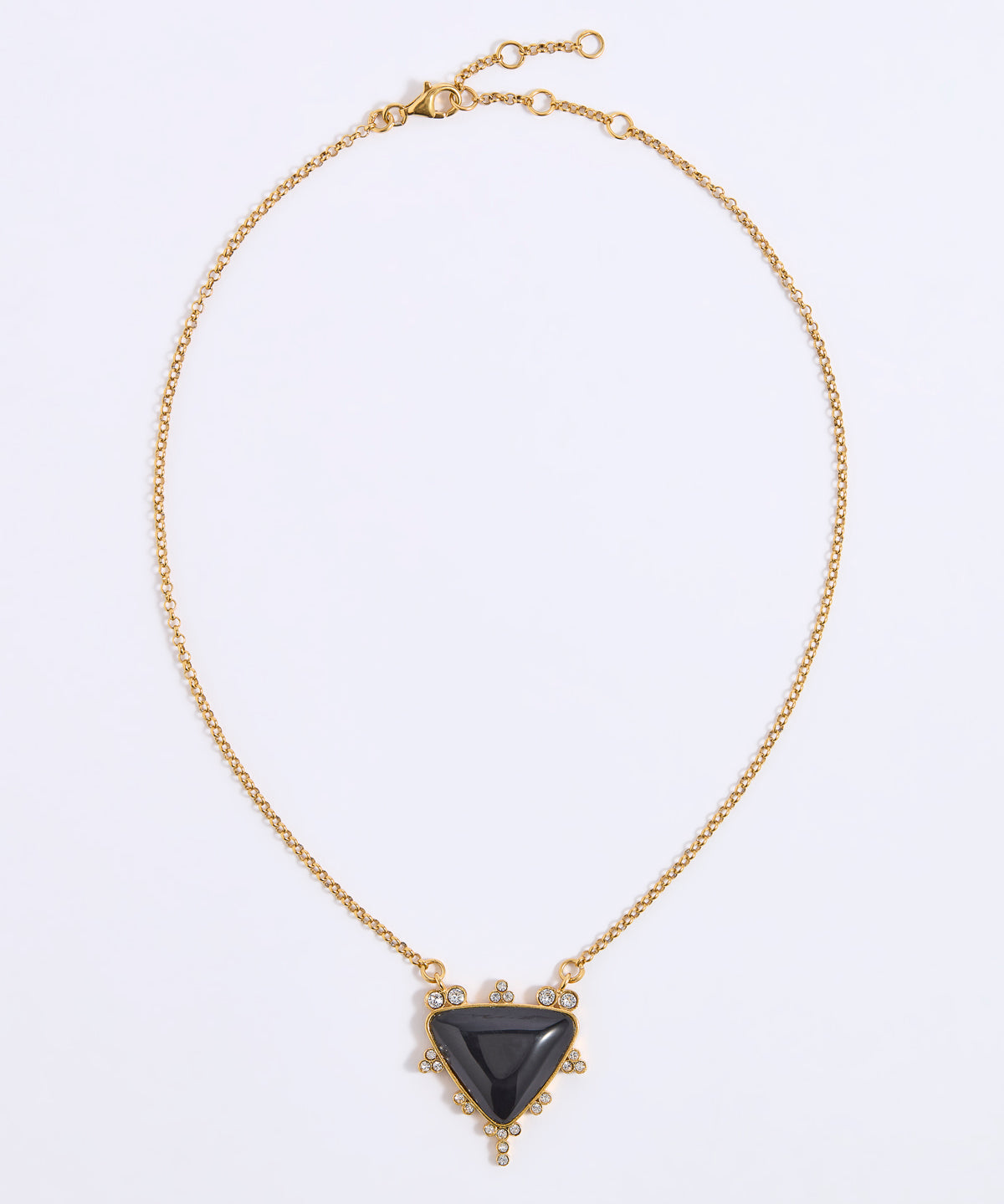 A gold chain necklace with a central triangular black stone pendant, accented with small clear stones around the pendant, shown on a plain white background.