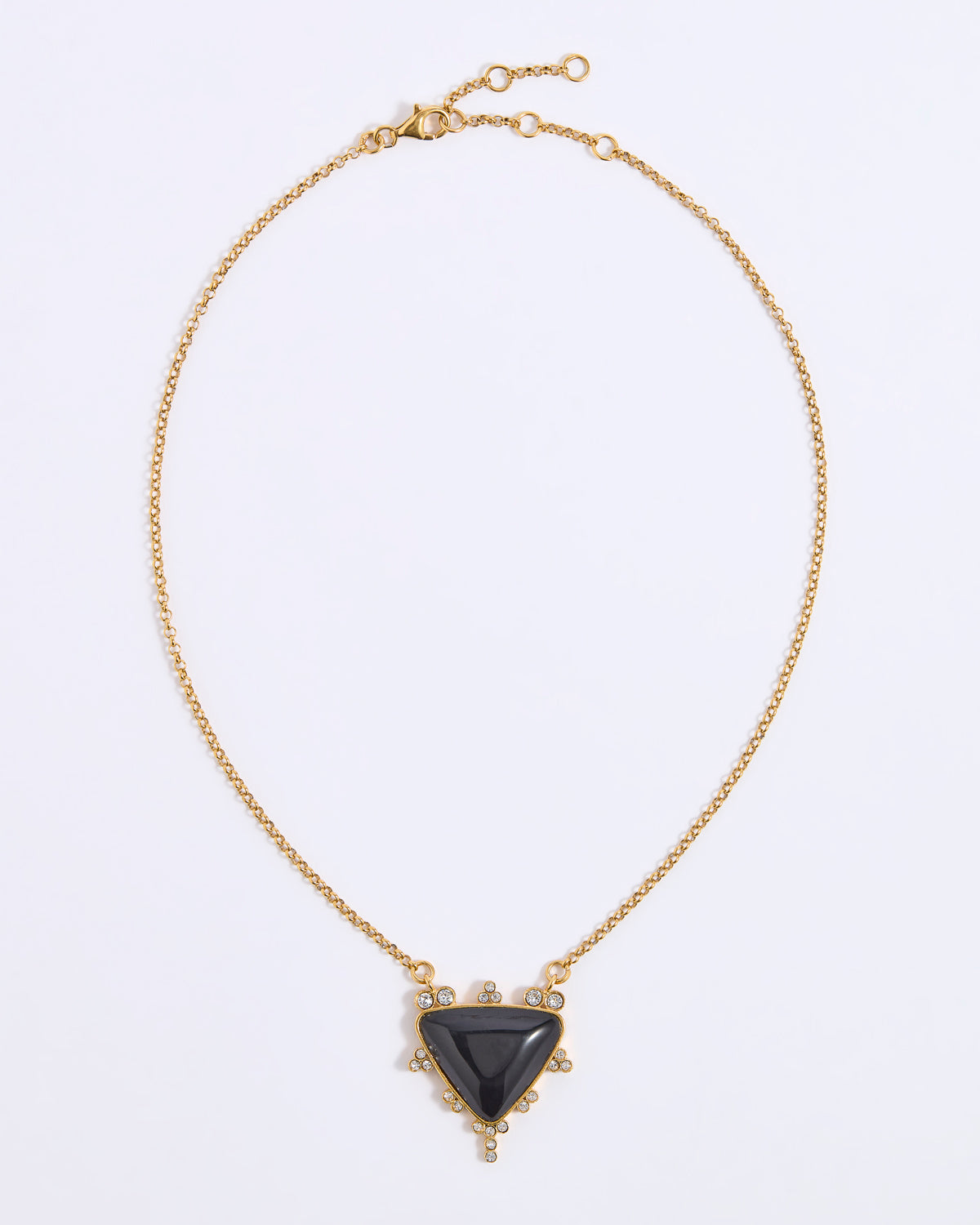 A gold chain necklace with a central triangular black stone pendant, accented with small clear stones around the pendant, shown on a plain white background.