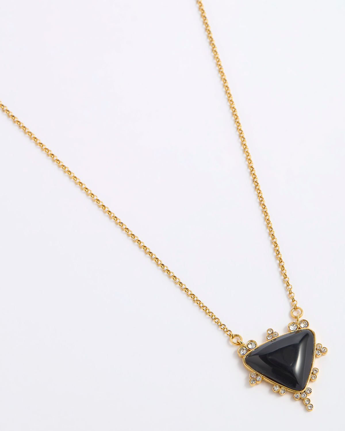 A gold chain necklace featuring a triangular black onyx pendant with small clear crystal accents in a gold setting, displayed on a white background.