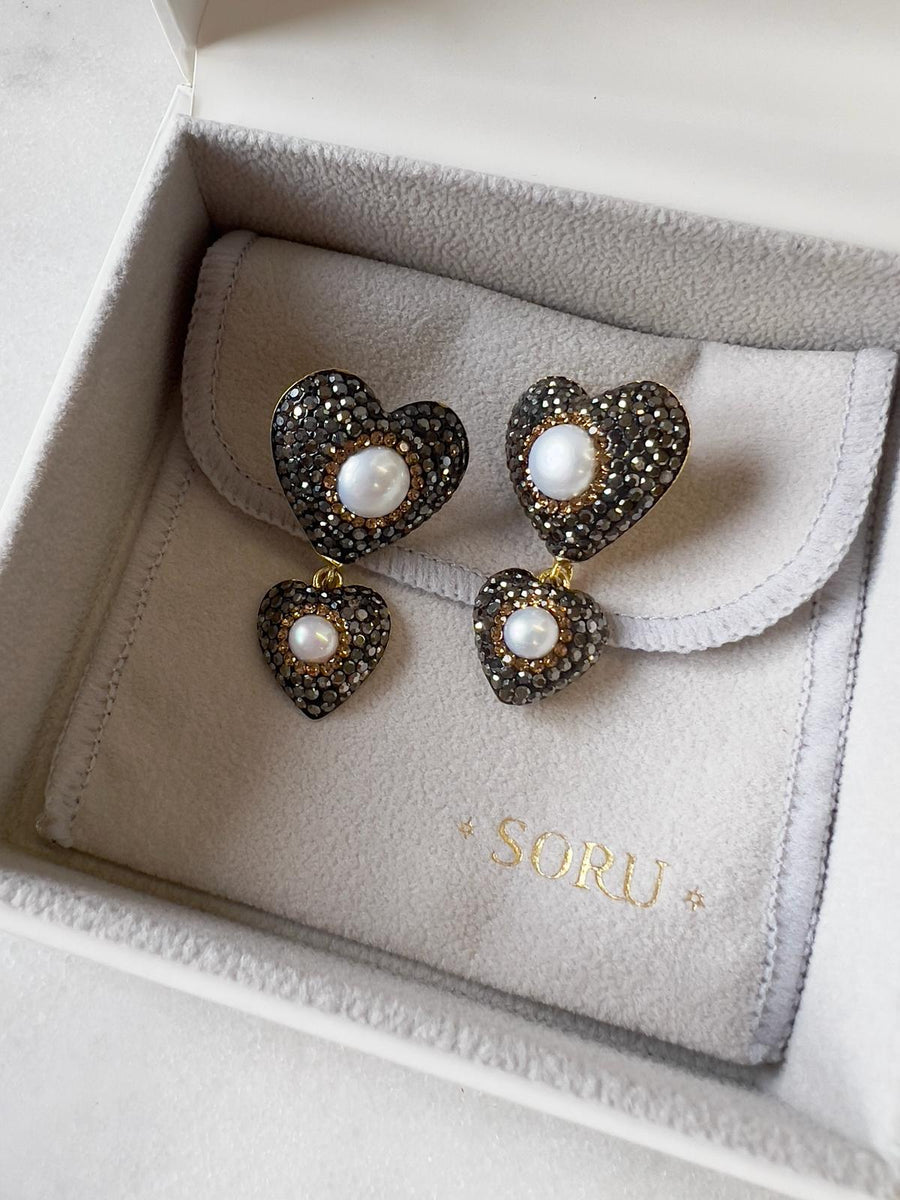 crystal and pearl mini heart earrings shown in soru jewellery box