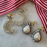 Pair of pearl earrings and crystal moon and star earrings