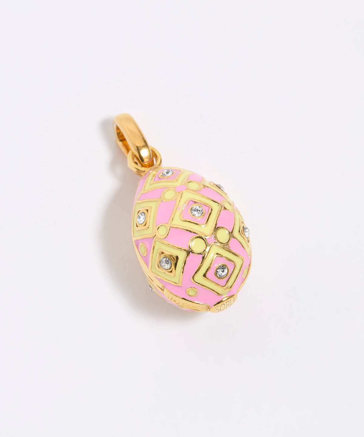 Pink, yellow and gold egg-shaped pendant on a light gray background