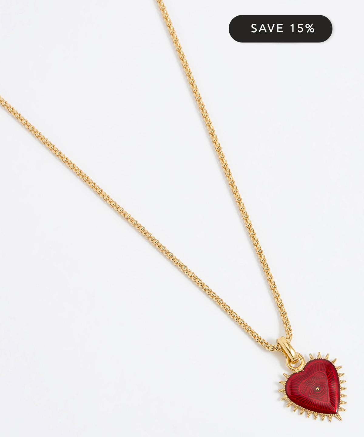 Product shot of Soru Jewellery red heart charm hung from a rope charm chain on white background