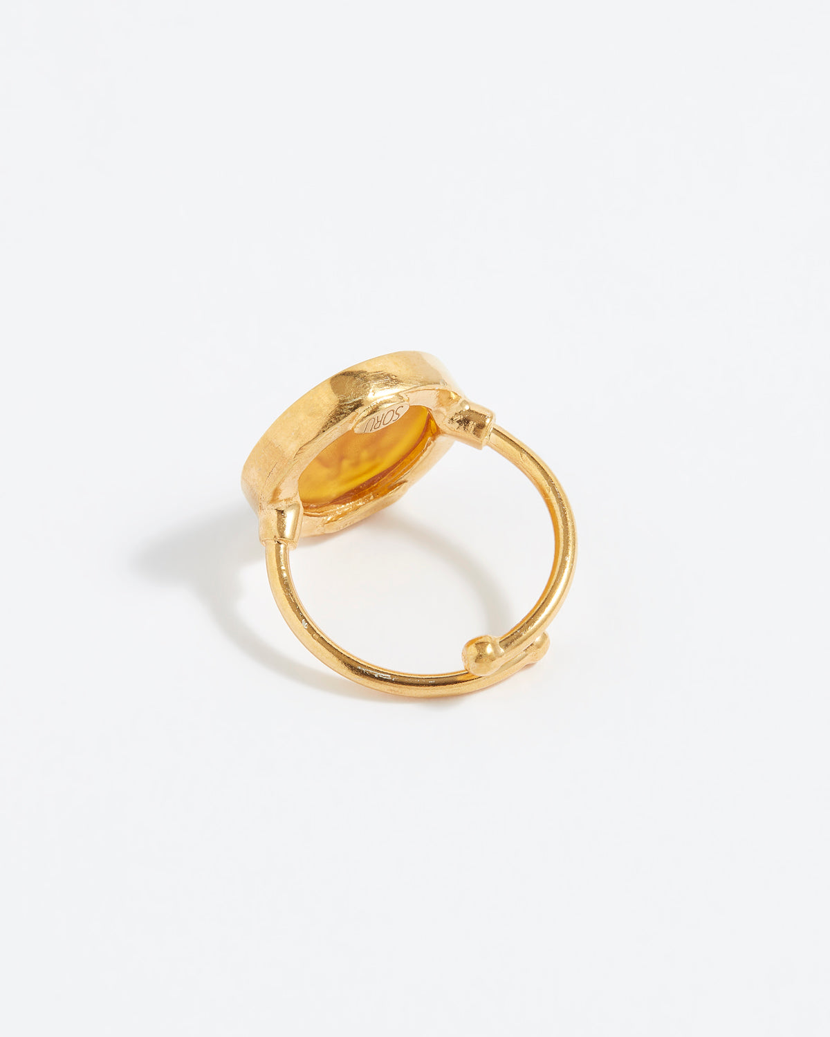Gold ring on a white background