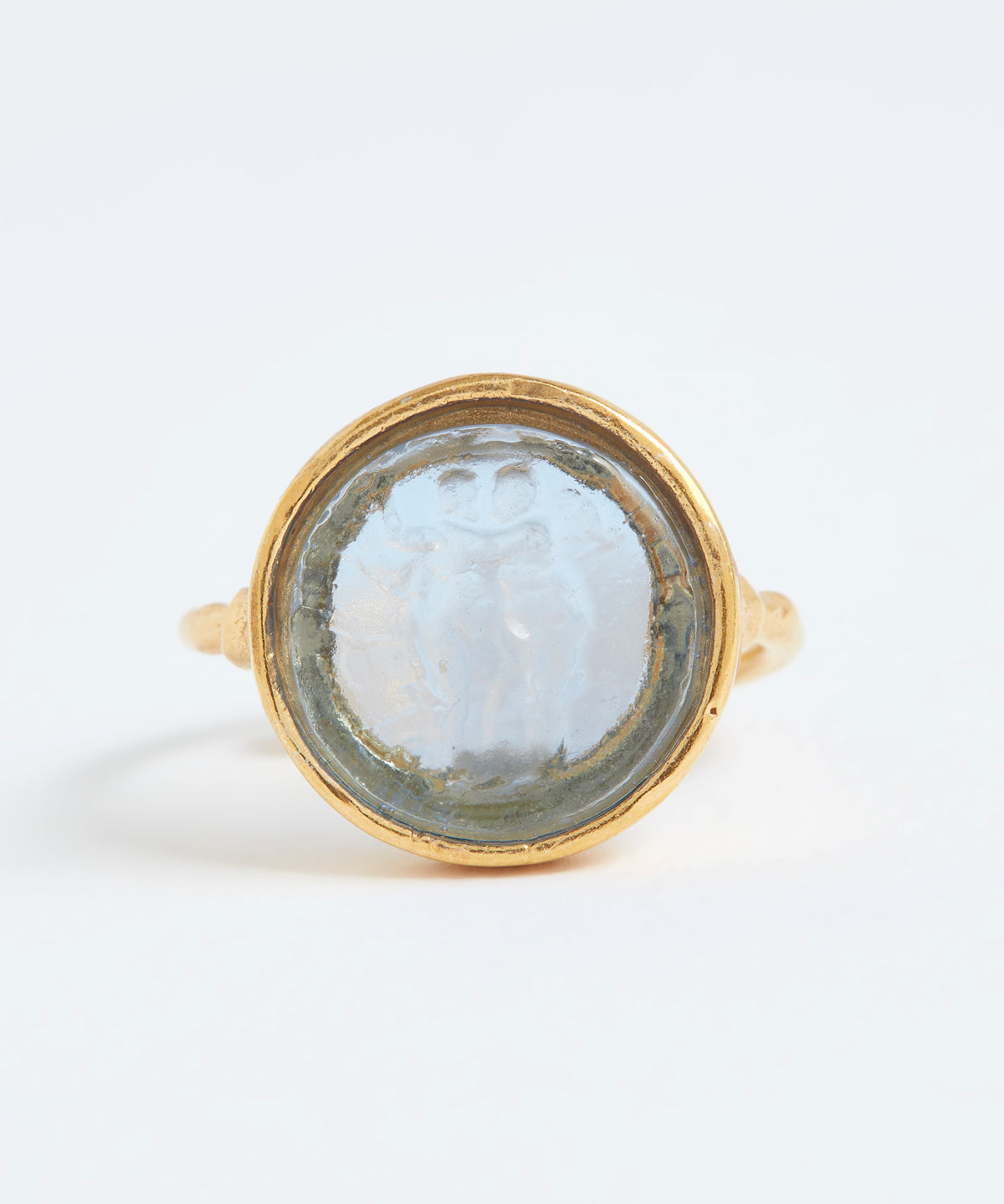 Gold ring with a circular stone on a white background