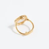 Gold ring with engraved text "This Too Shall Pass" on a white background