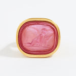 Pink stone with gold frame on a white background
