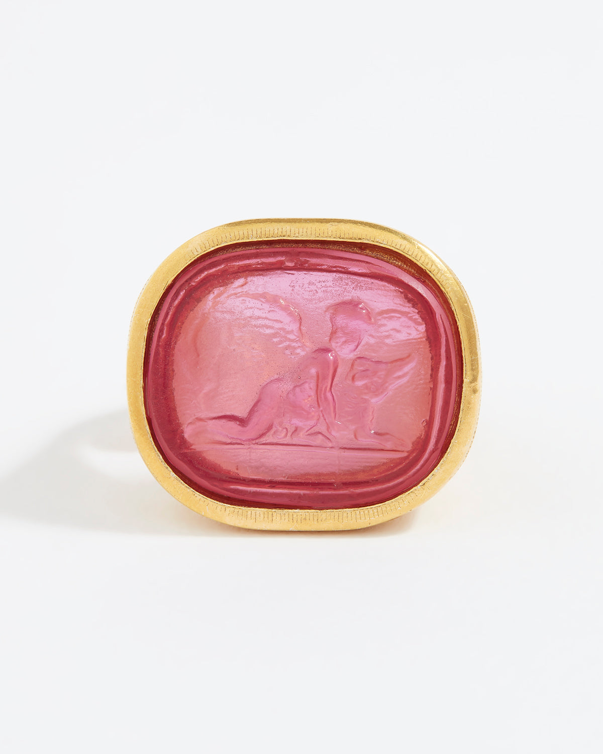 Pink stone with gold frame on a white background