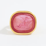 Pink stone with gold frame on a white background