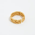Product shot of gold braided ring on white background