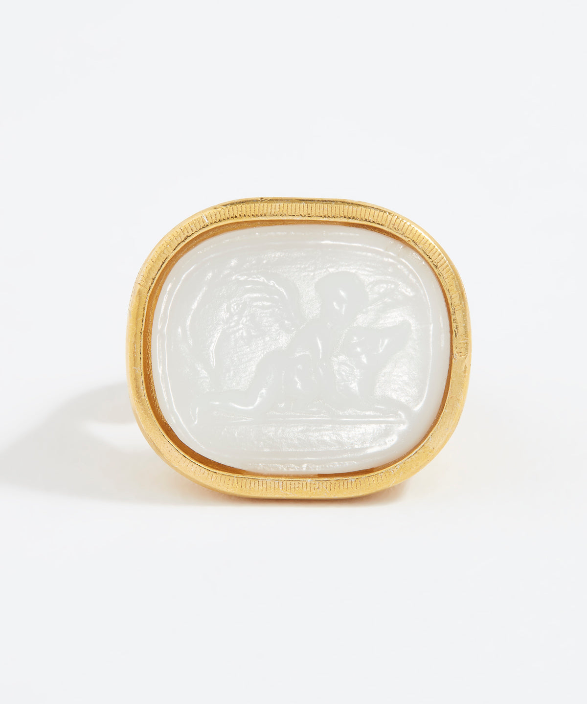 Decorative stone with gold frame on a white background