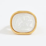 Decorative stone with gold frame on a white background