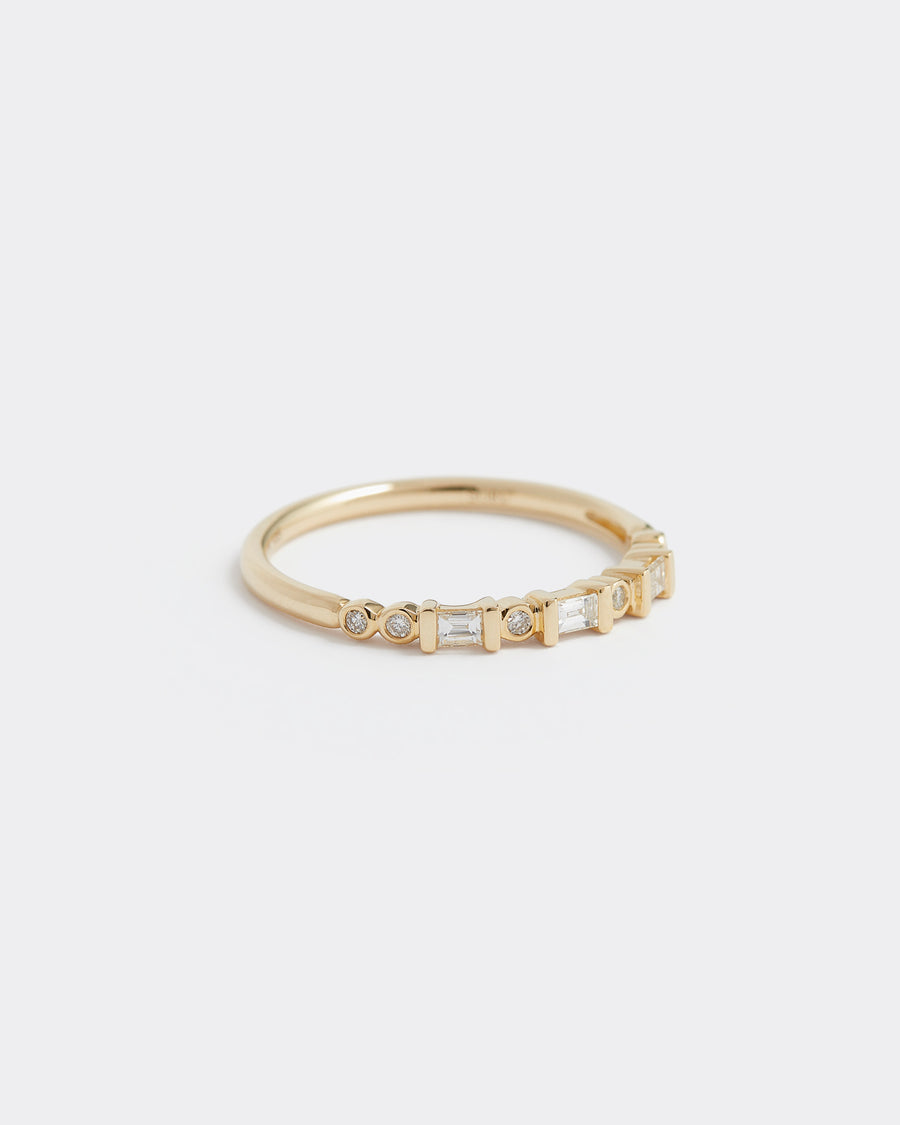 Soru Jewellery baguette and round cut diamond and gold ring, close up product shot 