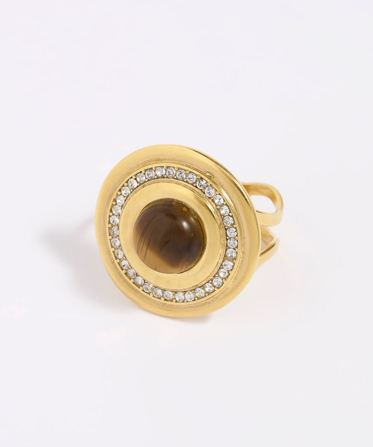 Gold ring with a central brown gemstone and diamond-studded band on a white background
