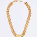 Gold chain necklace with a central pendant featuring a round pearl, on a white background