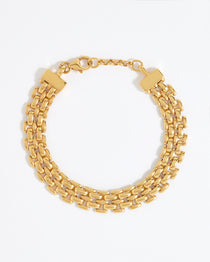 Gold chain bracelet on a white background