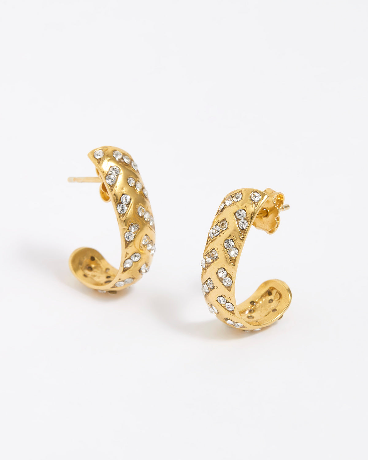 Gold hoop earrings with embedded stones on a white background
