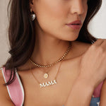 image of mama gold and white enamel necklace being worn