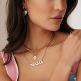 image of mama gold and white enamel necklace being worn
