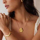 model image of textured curved gold bracelet cuff