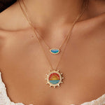 Soru Jewellery micro mosaic and diamond sunset pendant and opal pendant layered together on a model 