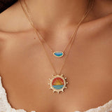 Soru Jewellery micro mosaic and diamond sunset pendant and opal pendant layered together on a model 