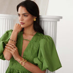 model image of textured curved gold bracelet cuff