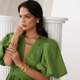 model image of textured curved gold bracelet cuff