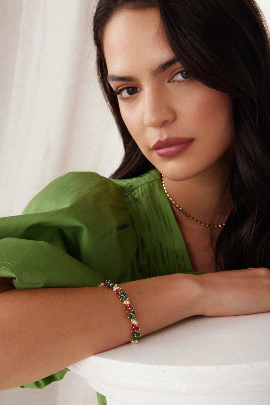 model shot of soru jewellery gold plated silver bracelet with green, and red jade gemstones and mini pearls