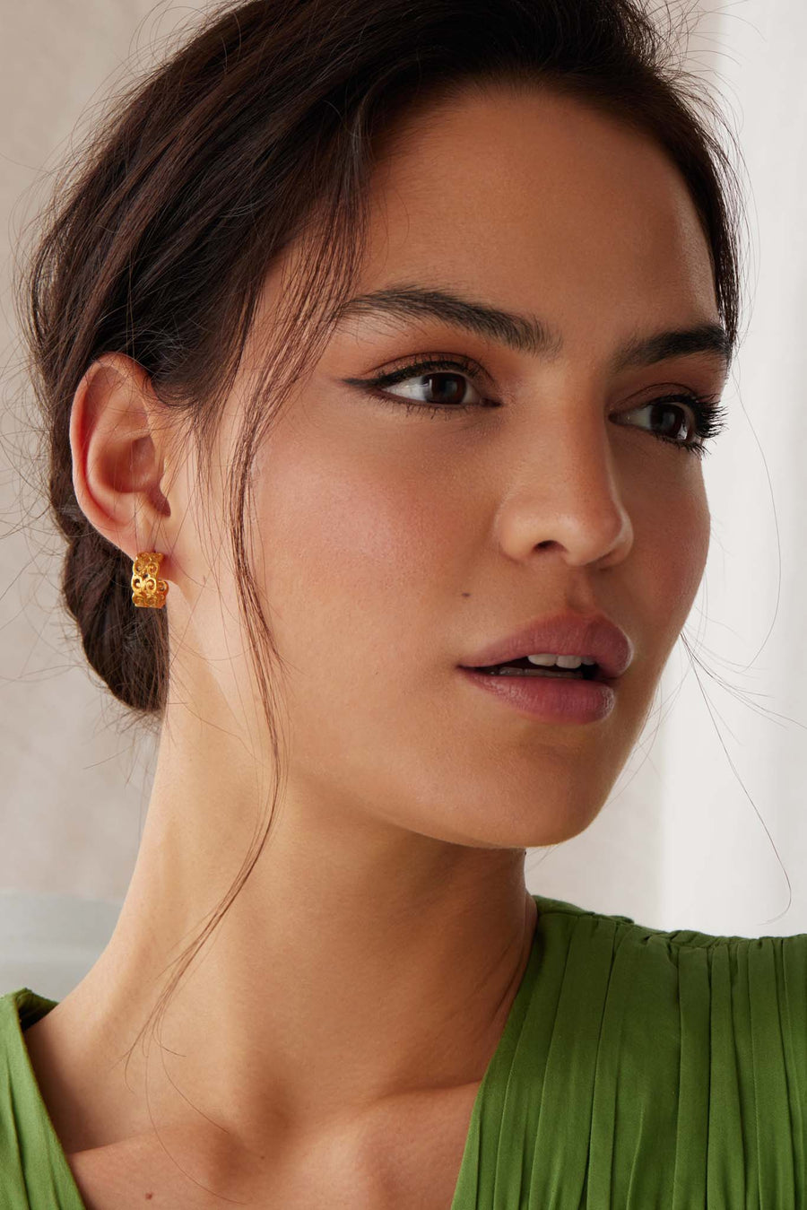 small gold cut out filigree hoop earrings on model shot 