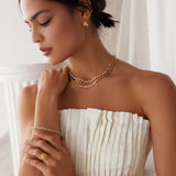 gold plated silver small hoops with fan, textured detailing