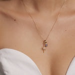 gold and diamond shining star charm, model shot of charm on necklace 