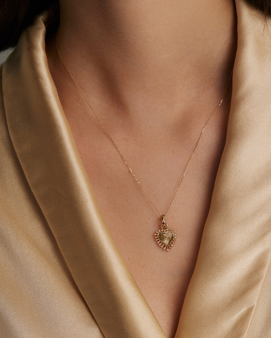 Soru Jewellery diamond and gold heart charm on necklace chain shot on model 