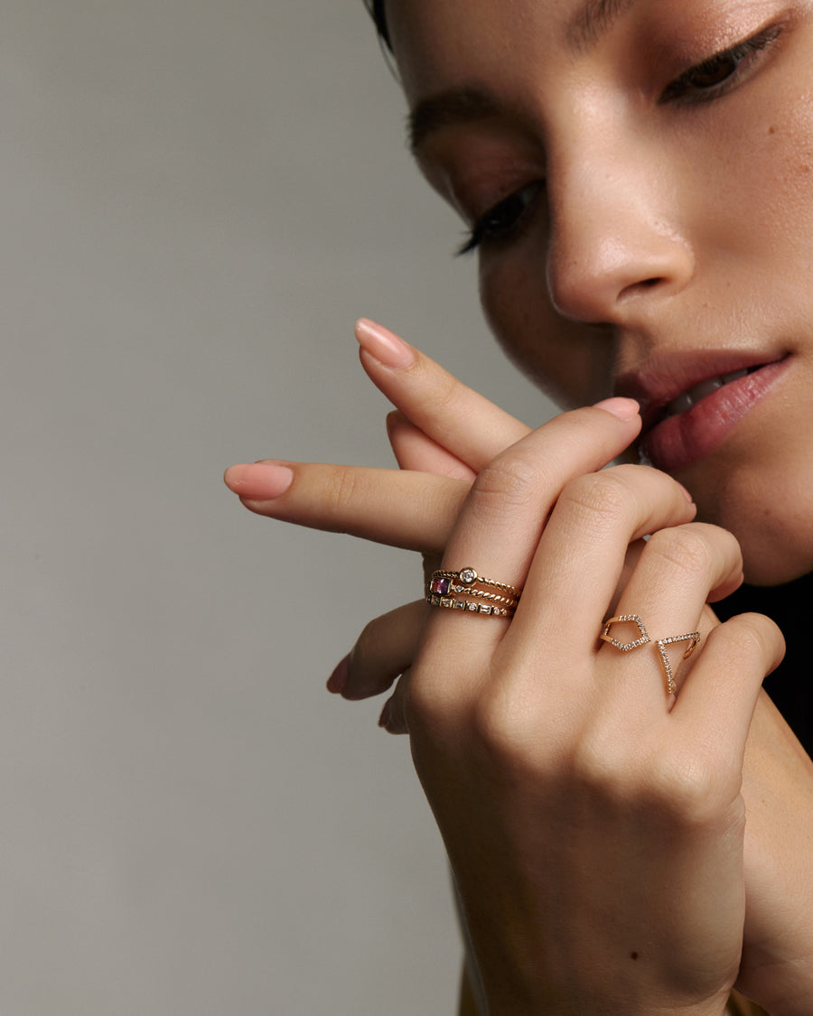 Soru Jewellery diamond and gold stacking rings shown on models hand