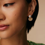 model shot of pearl stud earrings with crystal encrusted shell