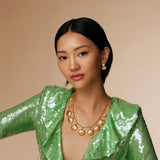 model shot of pearl stud earrings with crystal encrusted shell and shell necklace