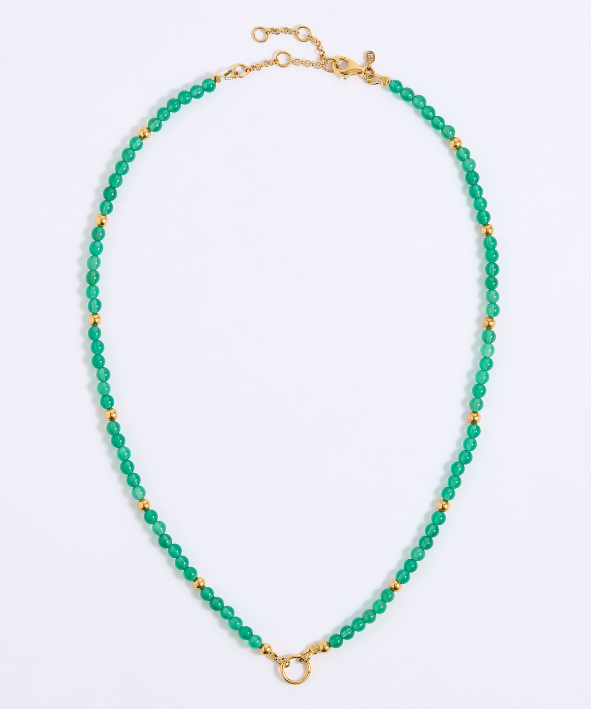 A beaded necklace featuring small, faceted green beads separated by round gold spacer beads, with a gold clasp and extender chain, displayed on a white background.