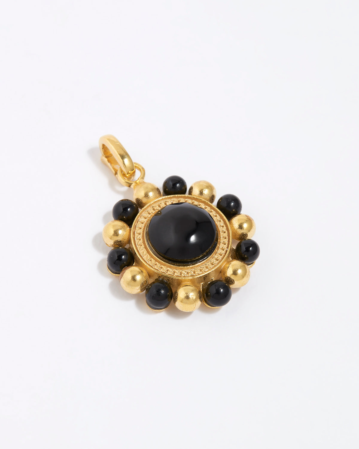 Gold circular charm pendant with central onyx stone with black and gold beaded edge,  on a white background