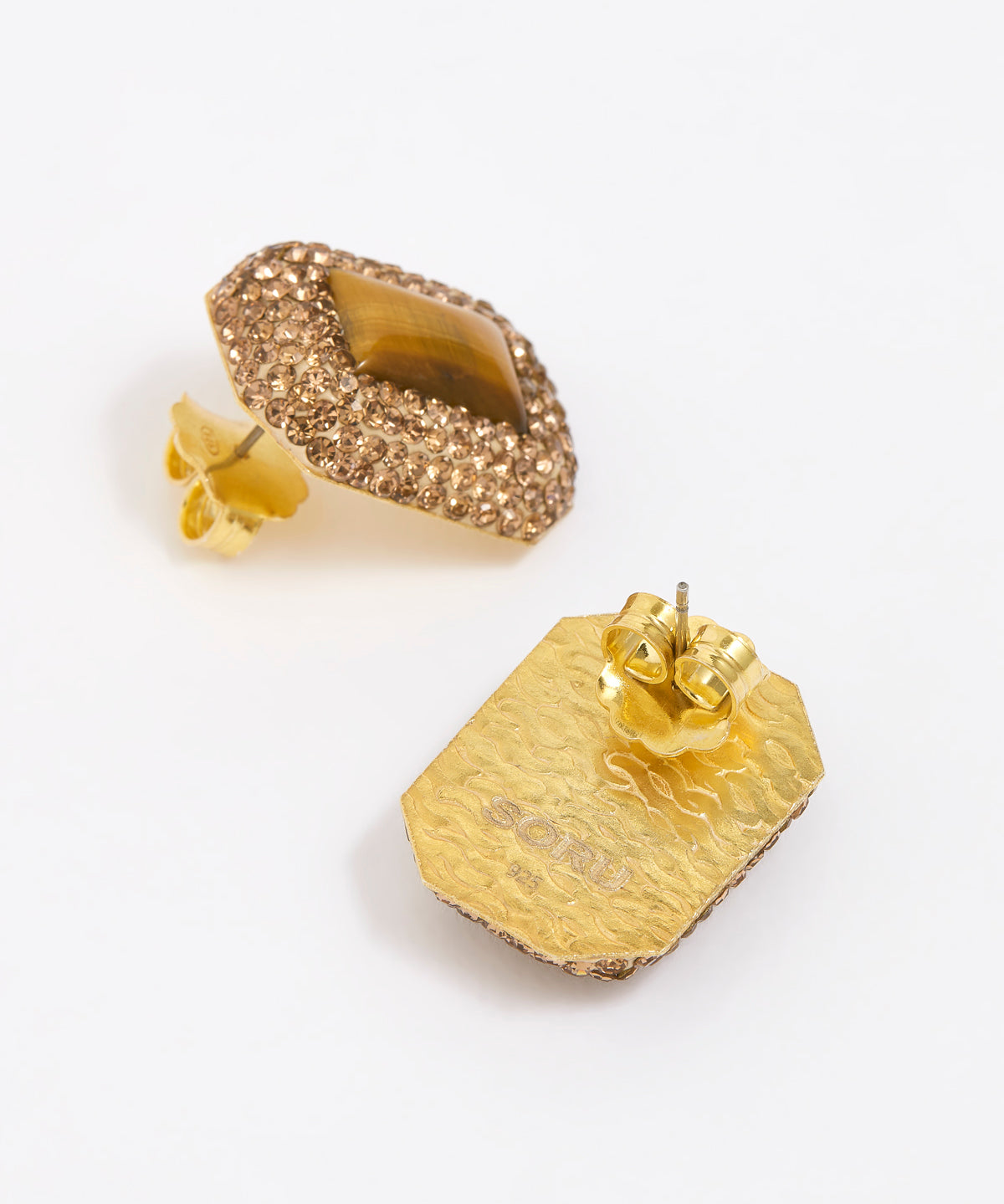 Pair of square stud earrings with brown crystals around a square tigers eye gemstone, on white background