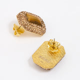 Pair of square stud earrings with brown crystals around a square tigers eye gemstone, on white background