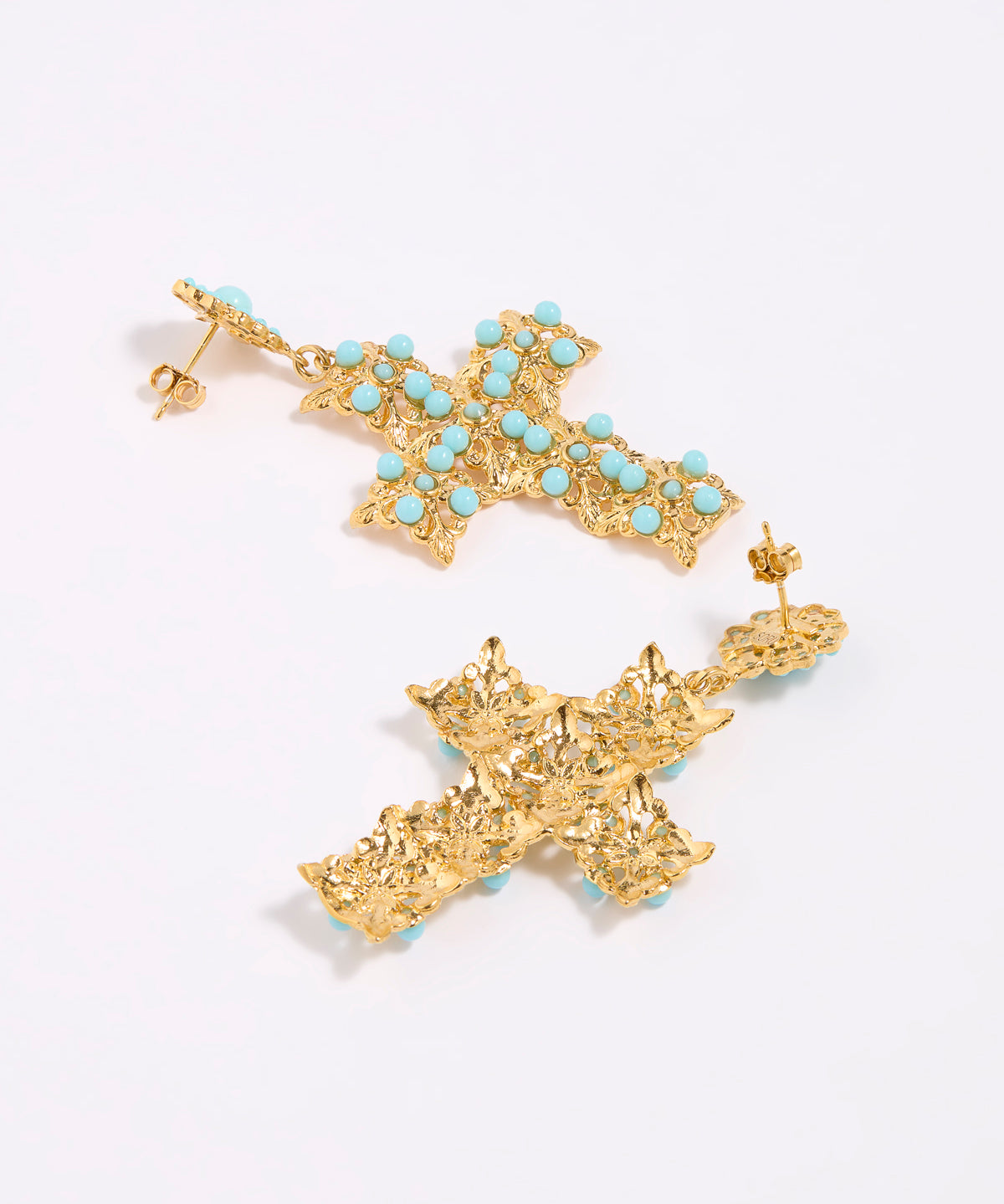 Gold cross-shaped earrings with turquoise stones on a white background