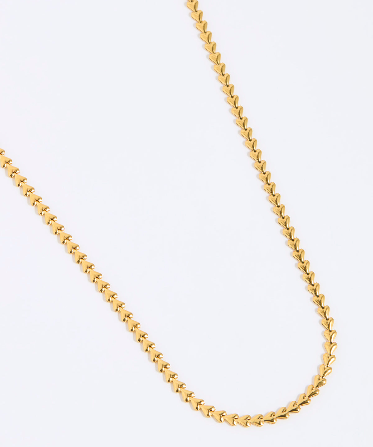 Gold chain of small hearts shown on white background