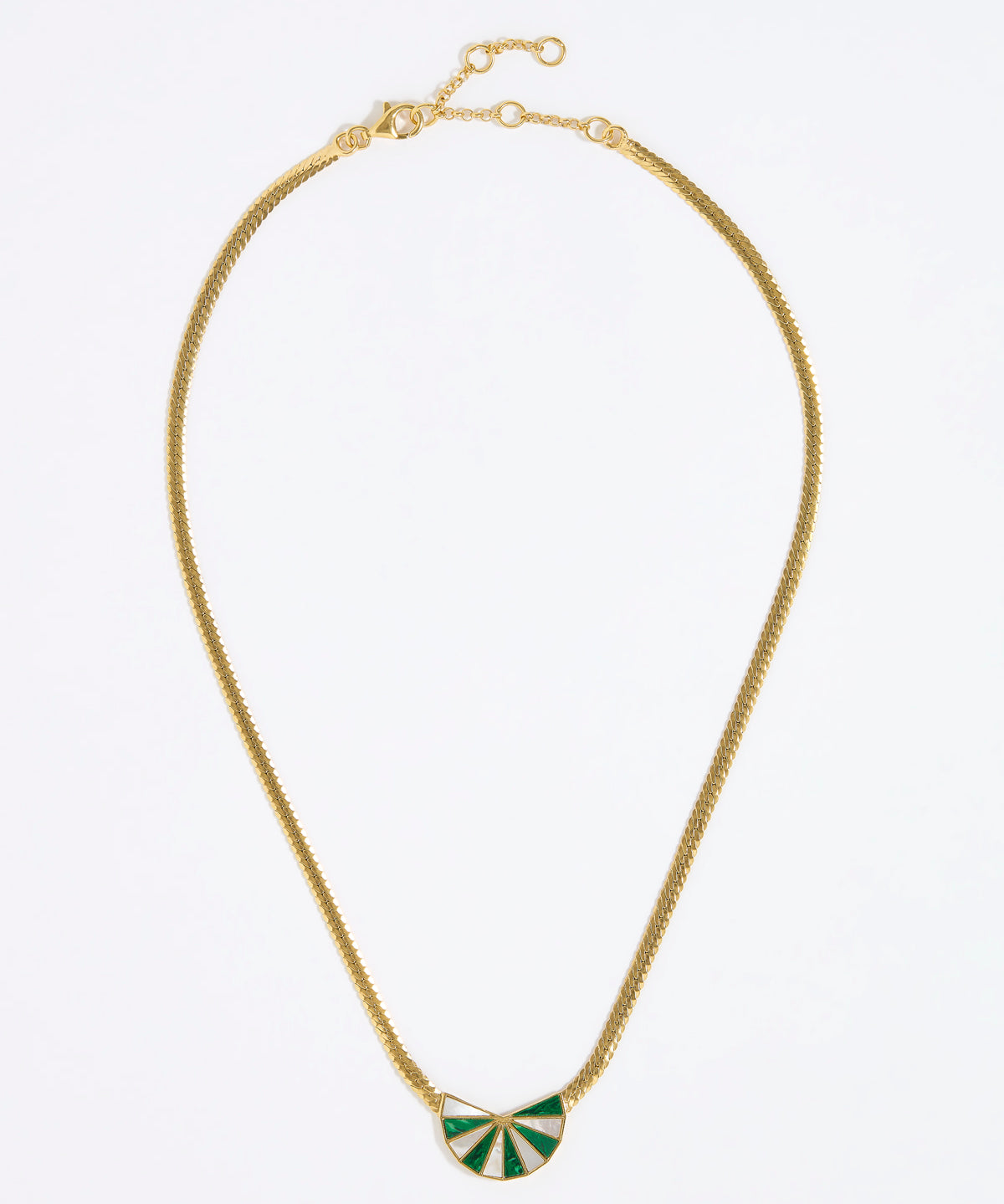 Gold necklace with a green and white fan shaped pendant on a white background